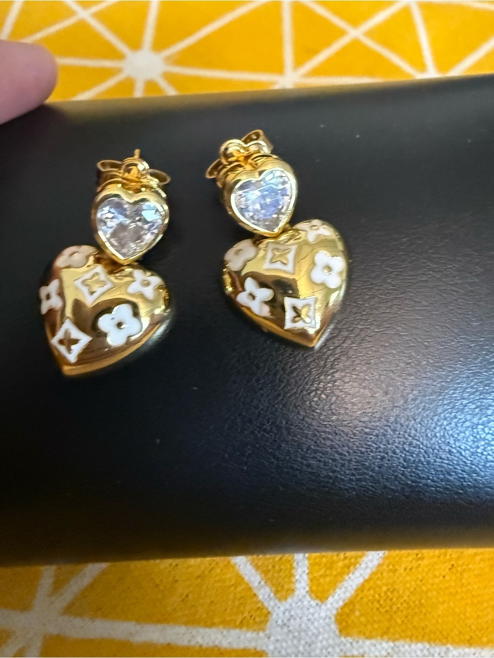 Gold Heart Drop Earrings with White Floral Accents